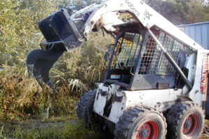 Skid steer loader stump remover